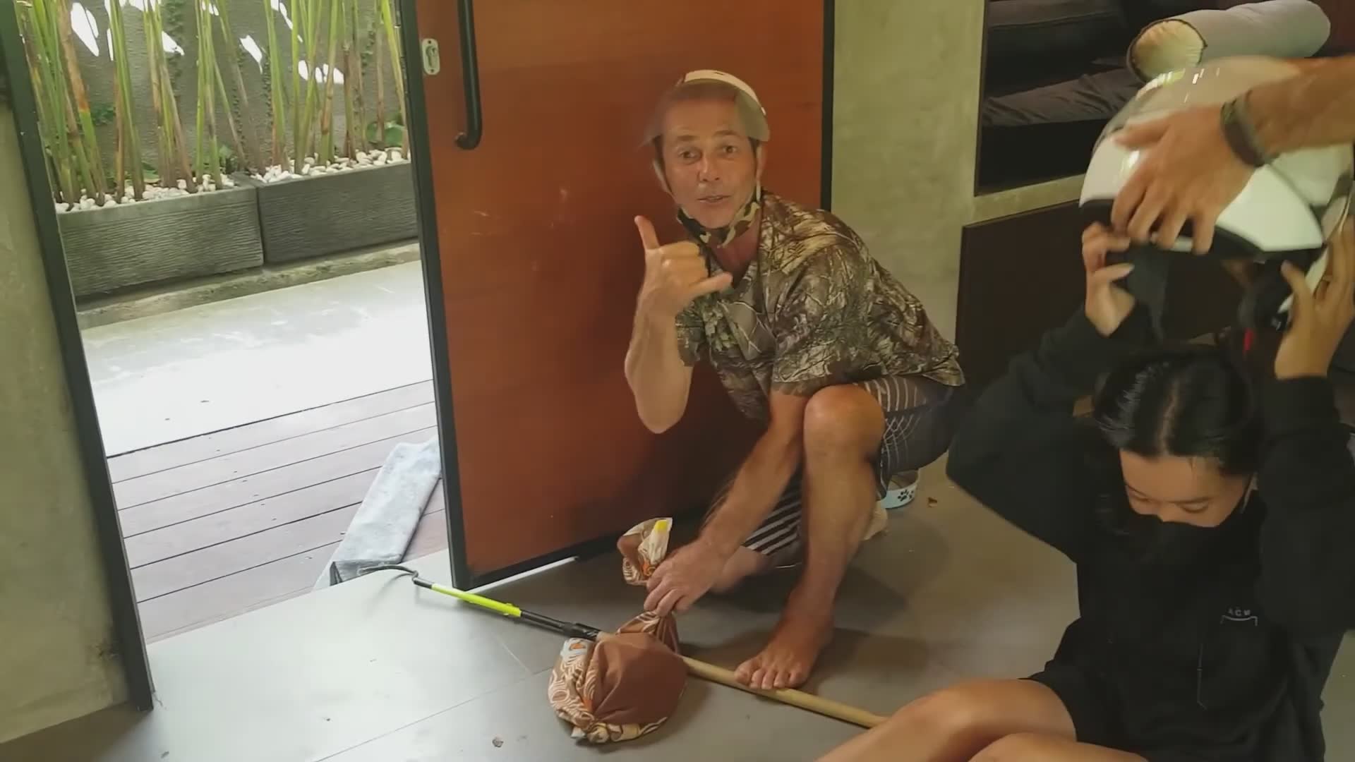 Spitting cobra encounters woman in motorcycle helmet