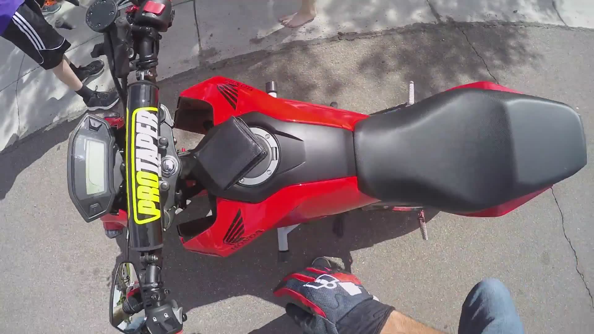 Biker stops for kids selling cookies and lemonade