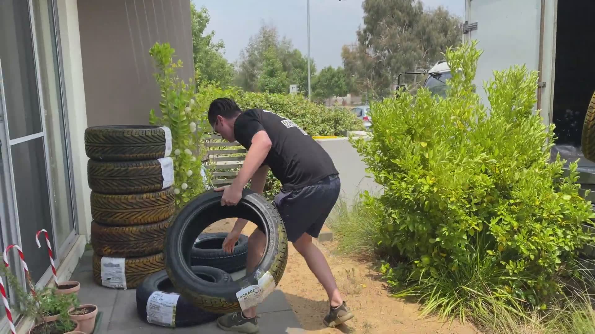 Preparing special colored smoke tires for the annual Canberra burnout competition
