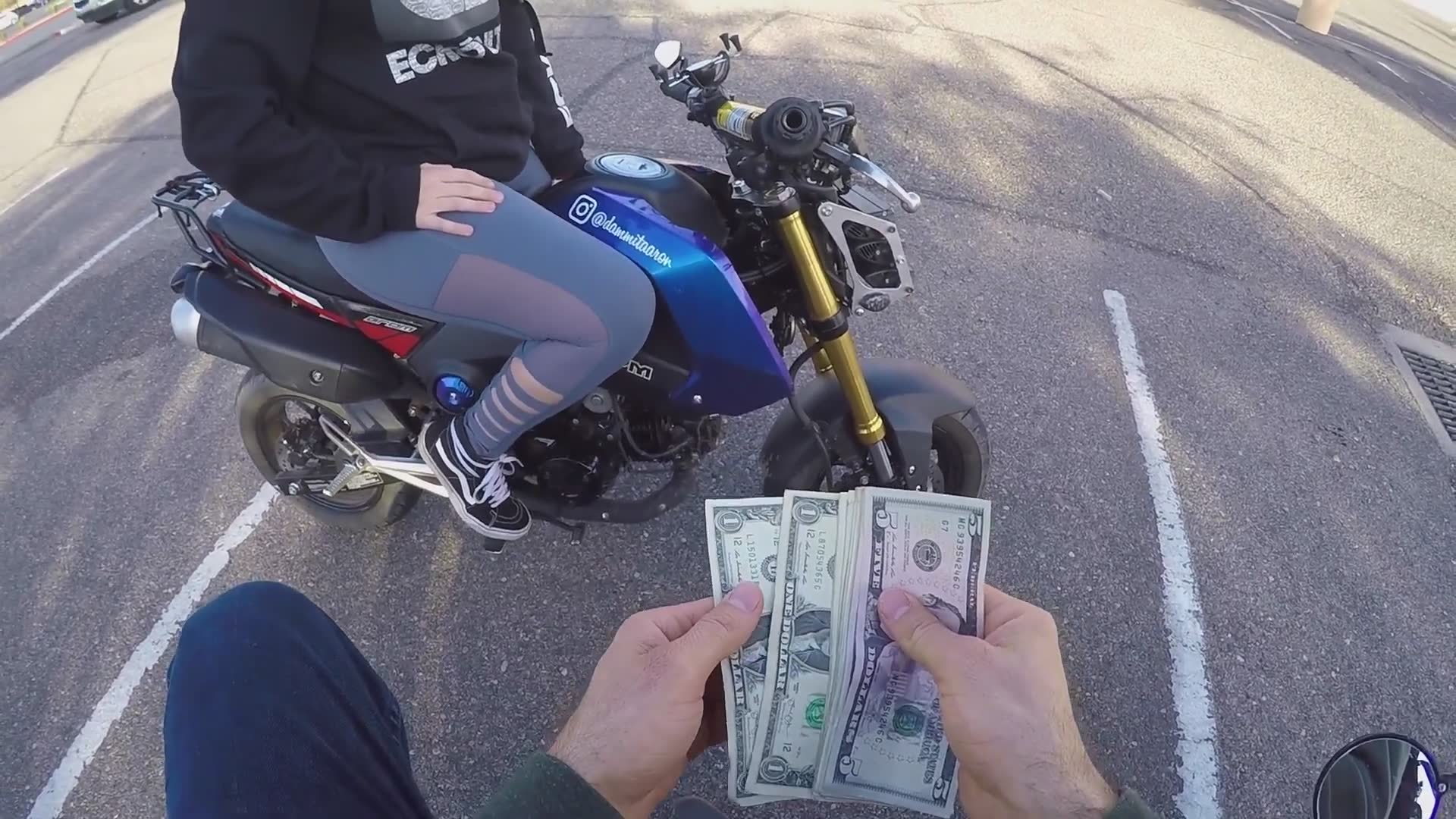 Motorcyclist offers strangers one dollar in exchange for random items and services