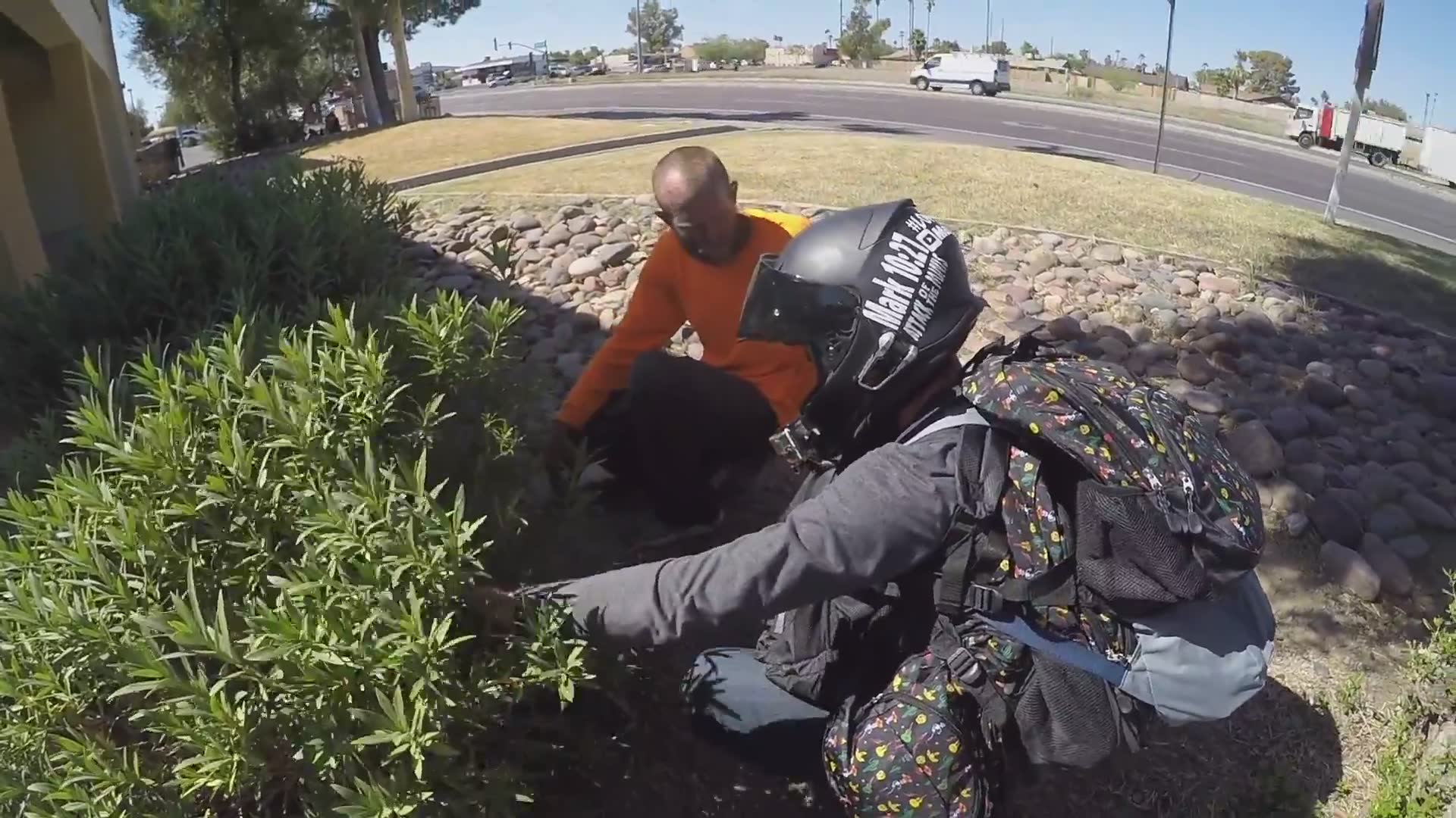 Charitable motorcycle riders distribute supplies to those experiencing homelessness