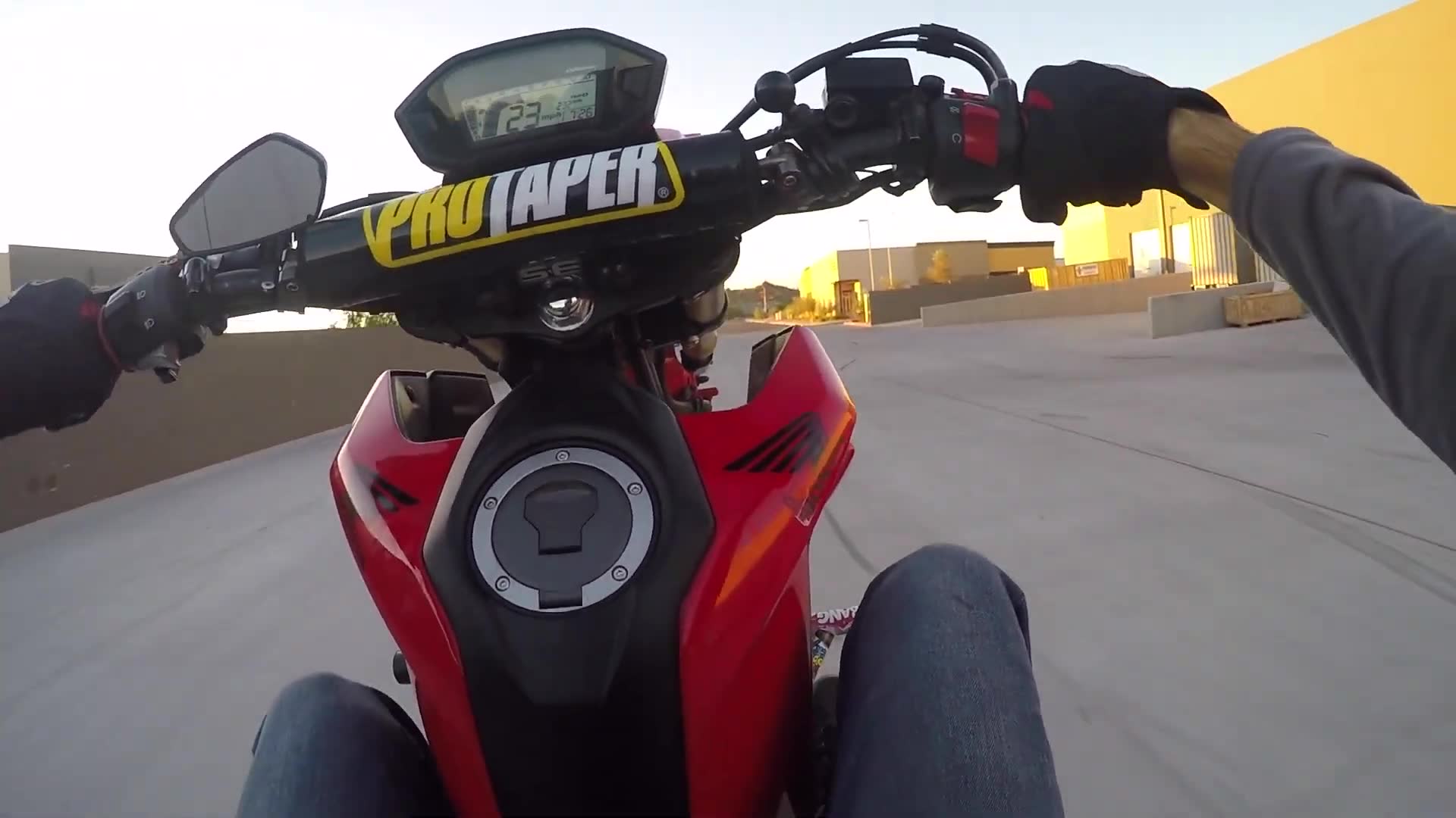 Practicing advanced motorcycle tricks and stunts in controlled environment