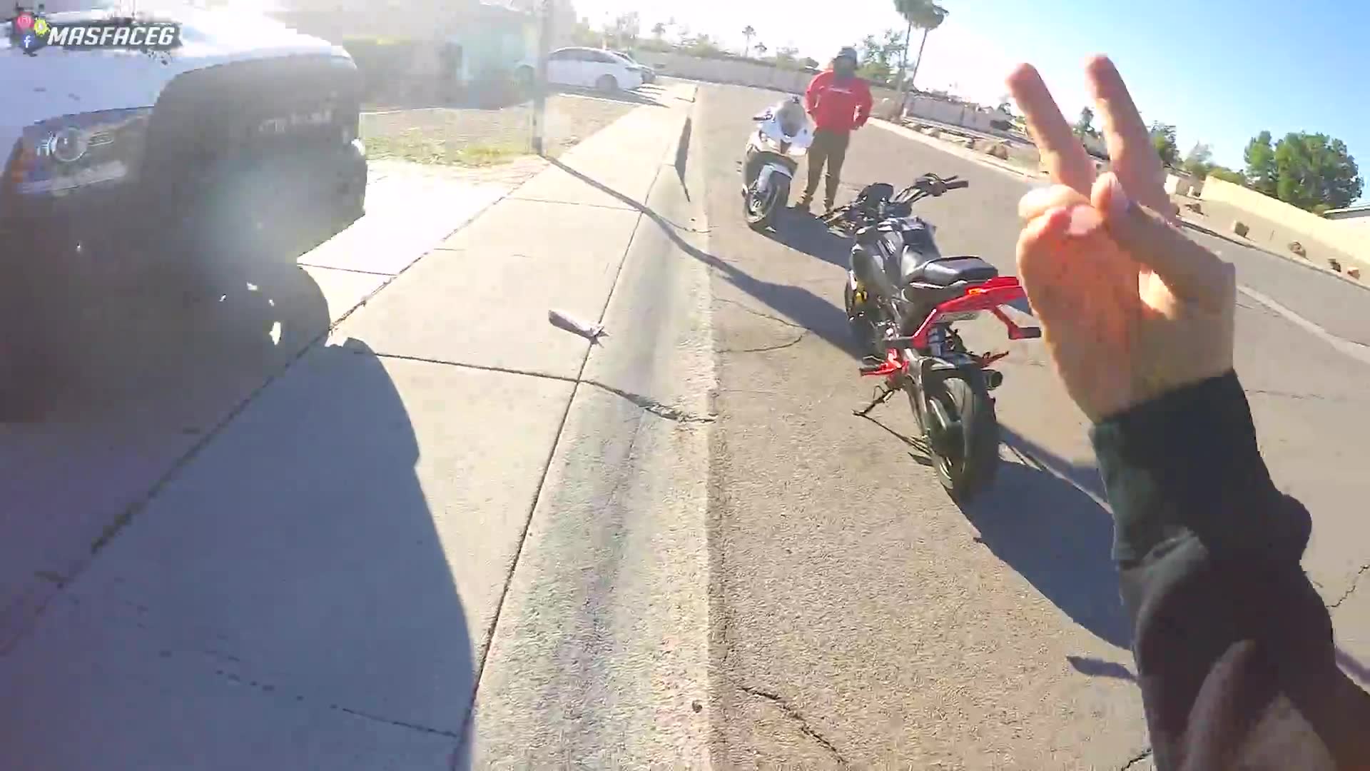 Attempting to order fast food while riding motorcycles through drive-through lane