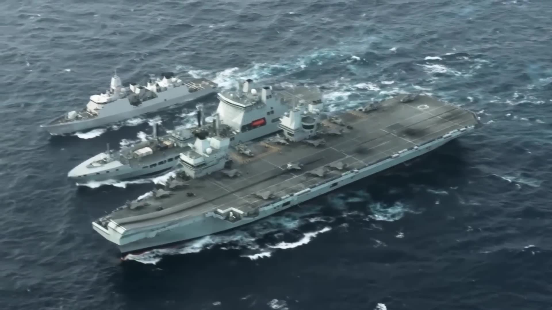 Chinese destroyer shadows British carrier