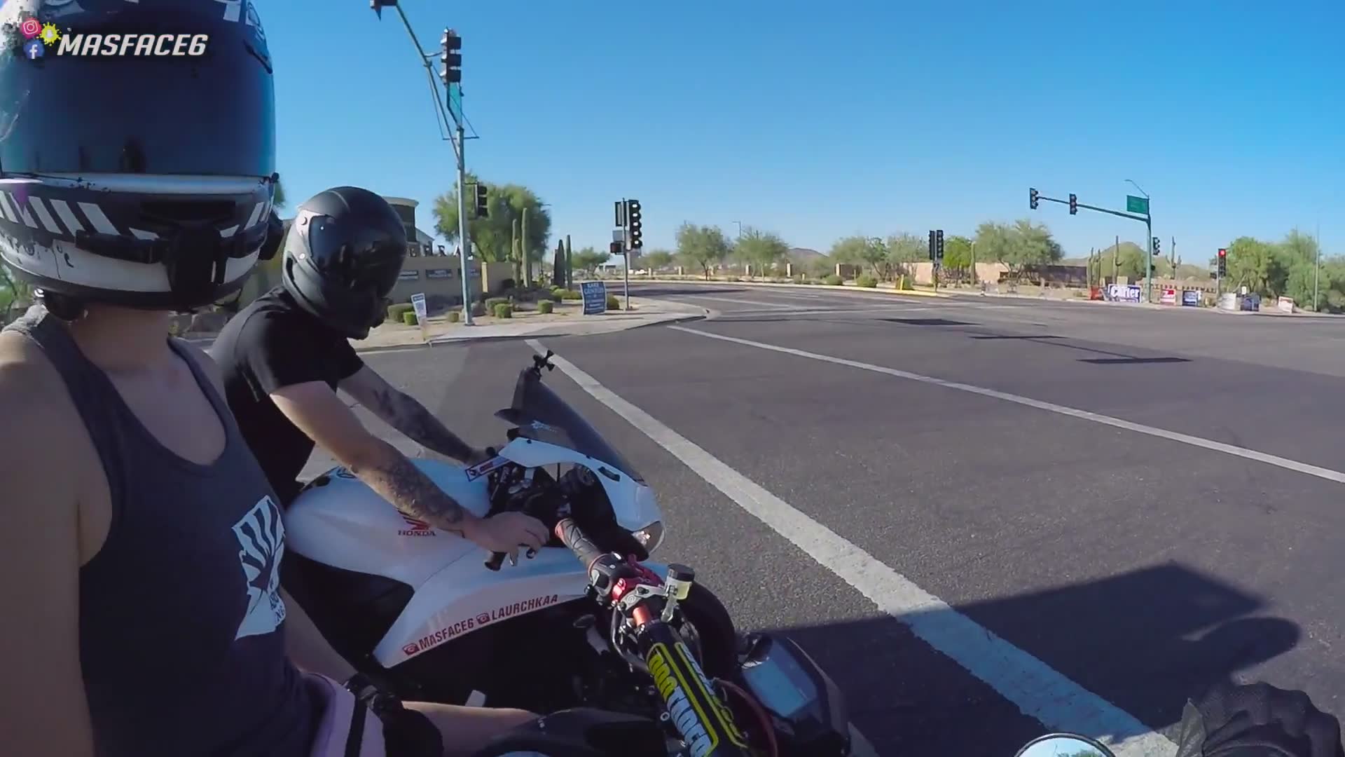 Riding motorcycles straight into the parking lot for a casual electronics store visit