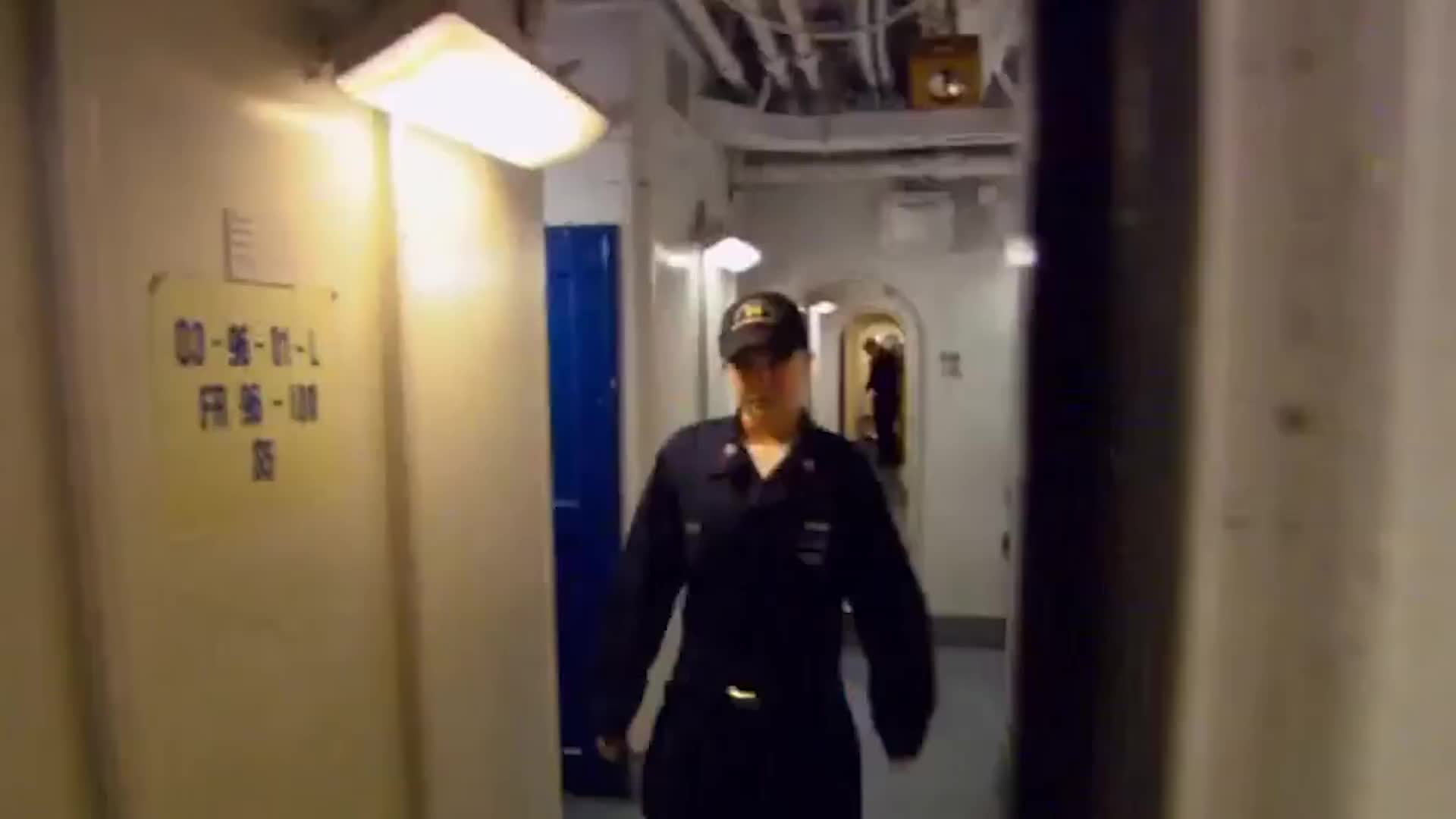 Below-deck passageways connecting carrier compartments