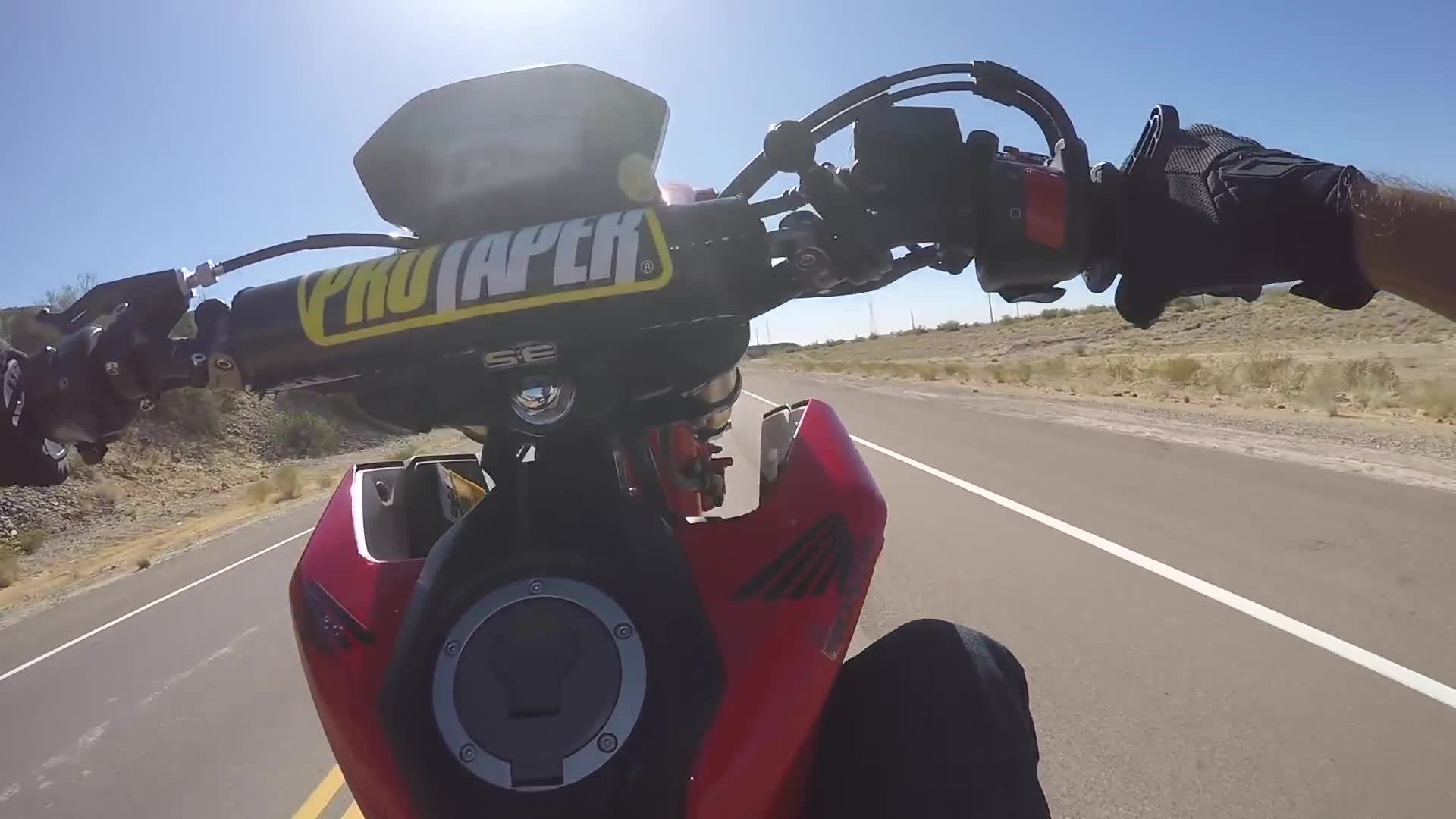 Teaching a new rider how to do her very first motorcycle wheelie from the basics up
