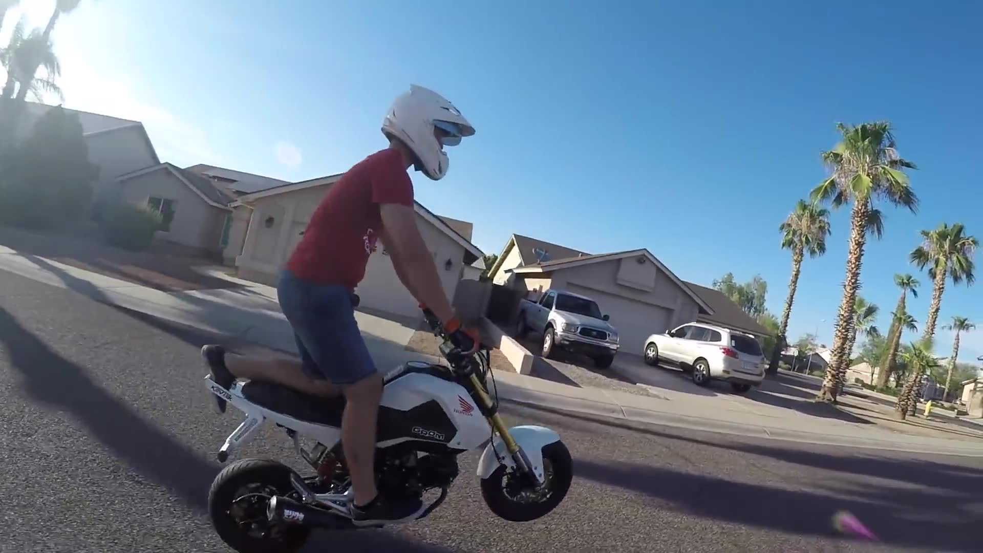 Motorcycle rider tries flirting with strangers while cruising through town