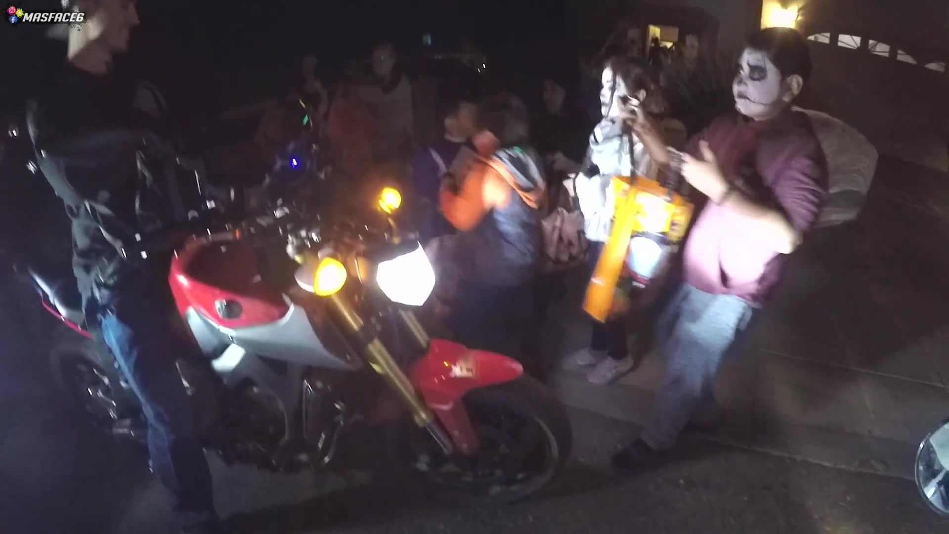 Motorcycle riders go trick or treating on their bikes and collect a massive candy haul