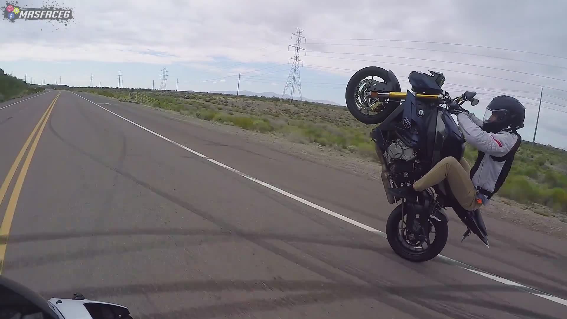 Incredible display of wheelie control on a large adventure motorcycle on the road