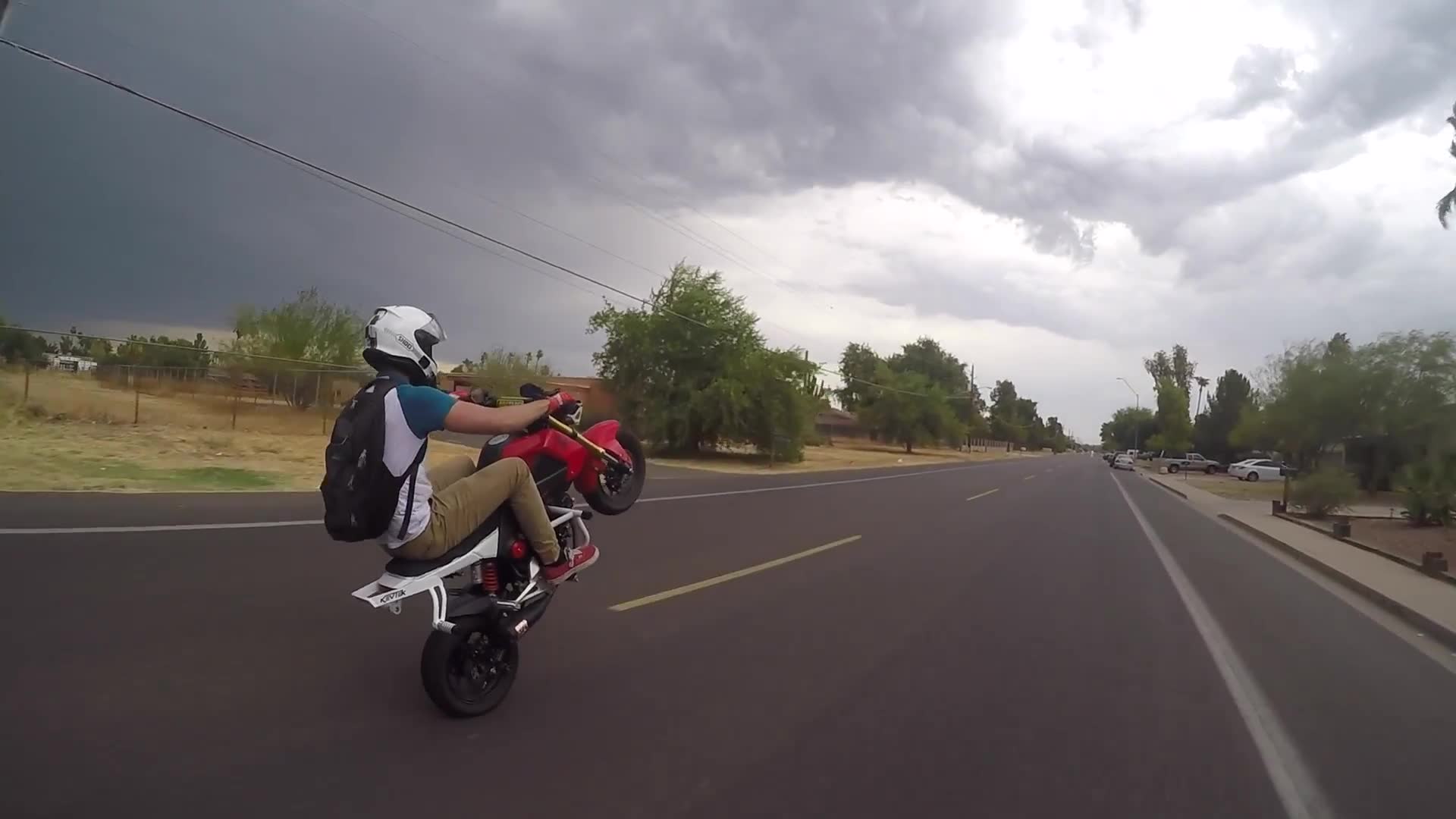 Intense motorcycle ride through a severe storm with heavy winds and pouring rain