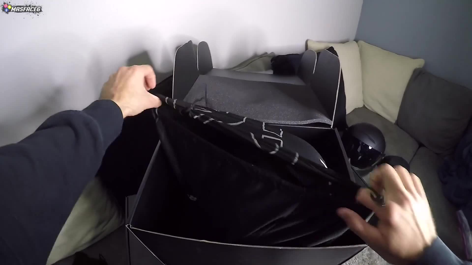 Unboxing a sleek new all-black premium motorcycle helmet straight from the shipping box