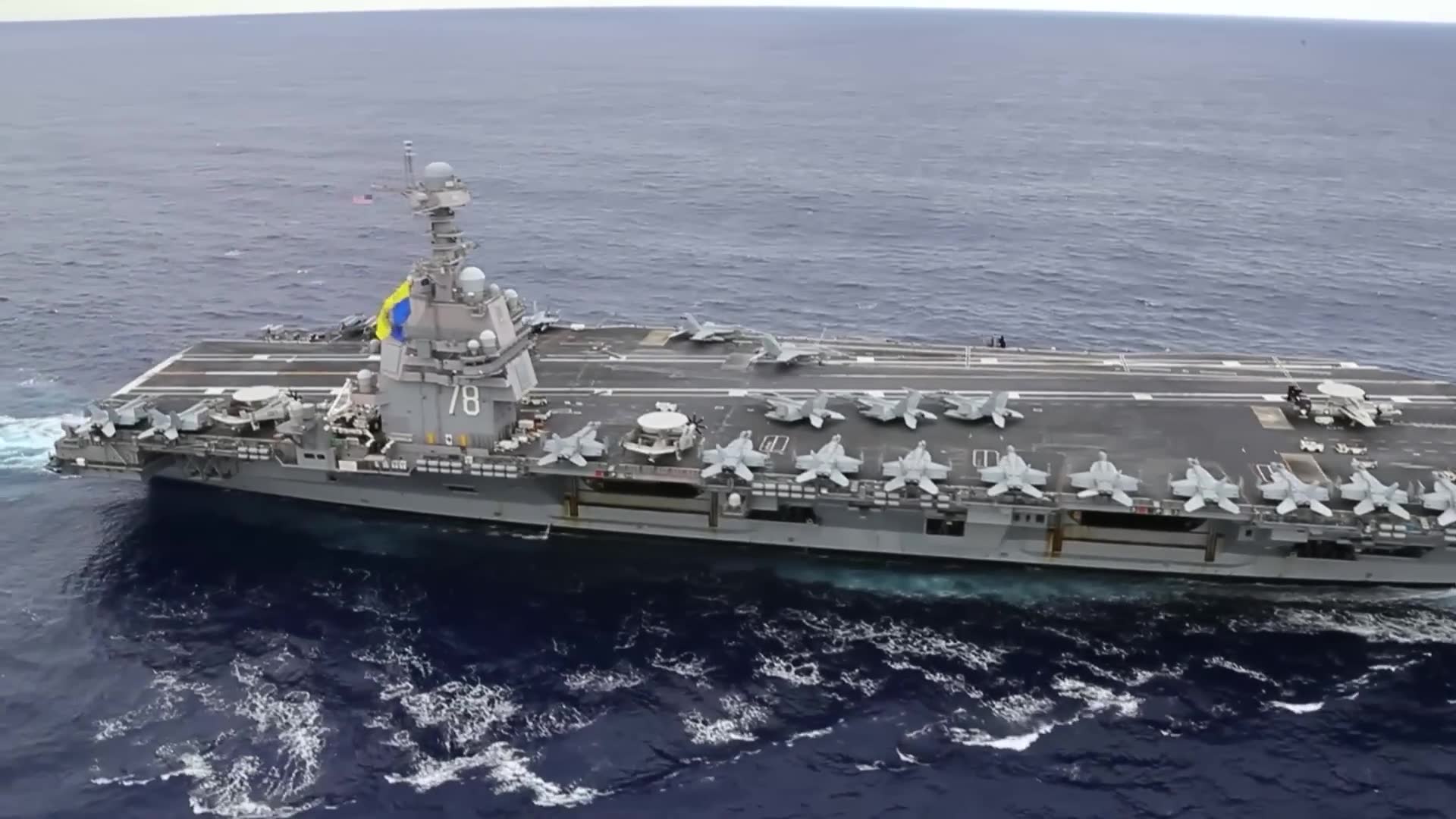 Fighter executes aggressive dive toward carrier deck