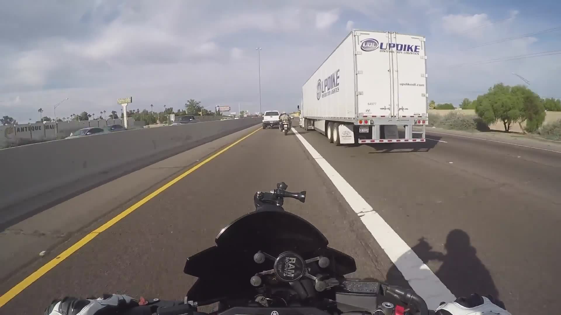 Motorcycle dash cam captures a law enforcement officer breaking the very same rules