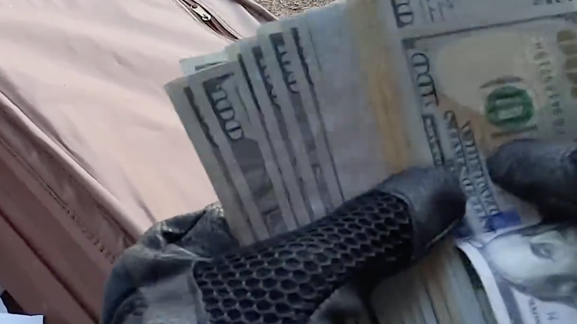 Unbelievable find as biker stumbles upon thousands of dollars stashed under a bridge