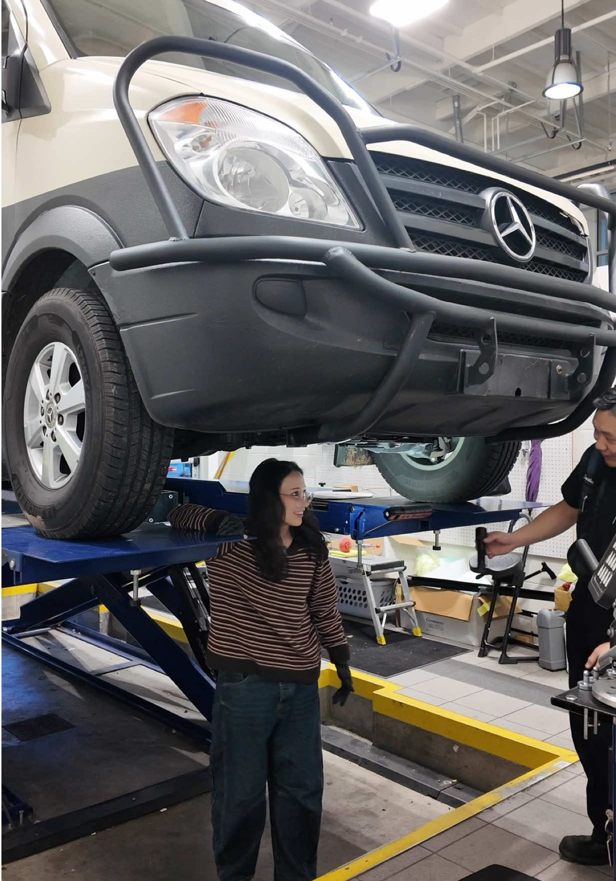Getting my new campervan inspected on a lift with a mechanic friend