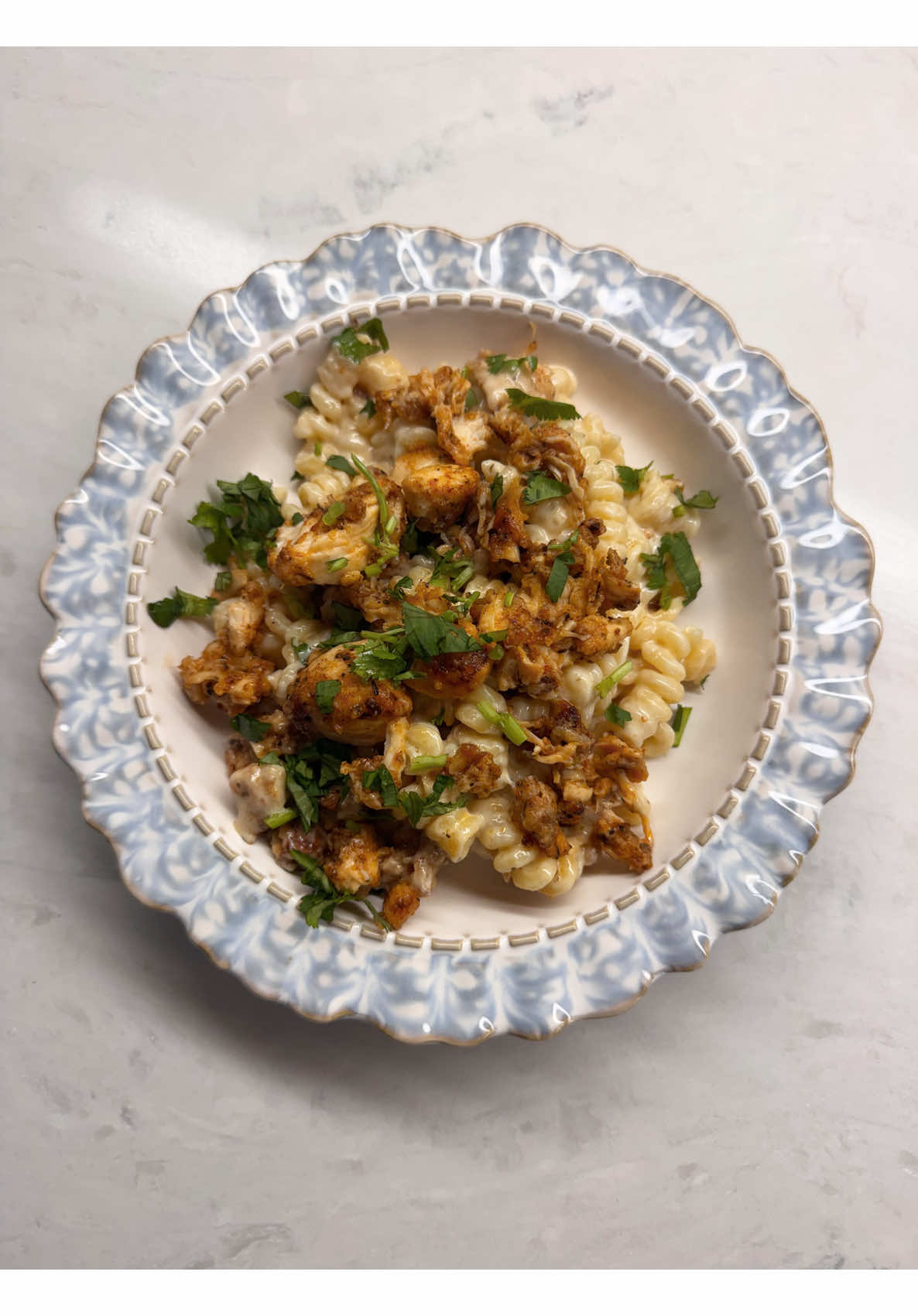 Creamy chicken fusilli pasta dinner recipe with crispy topping and fresh parsley
