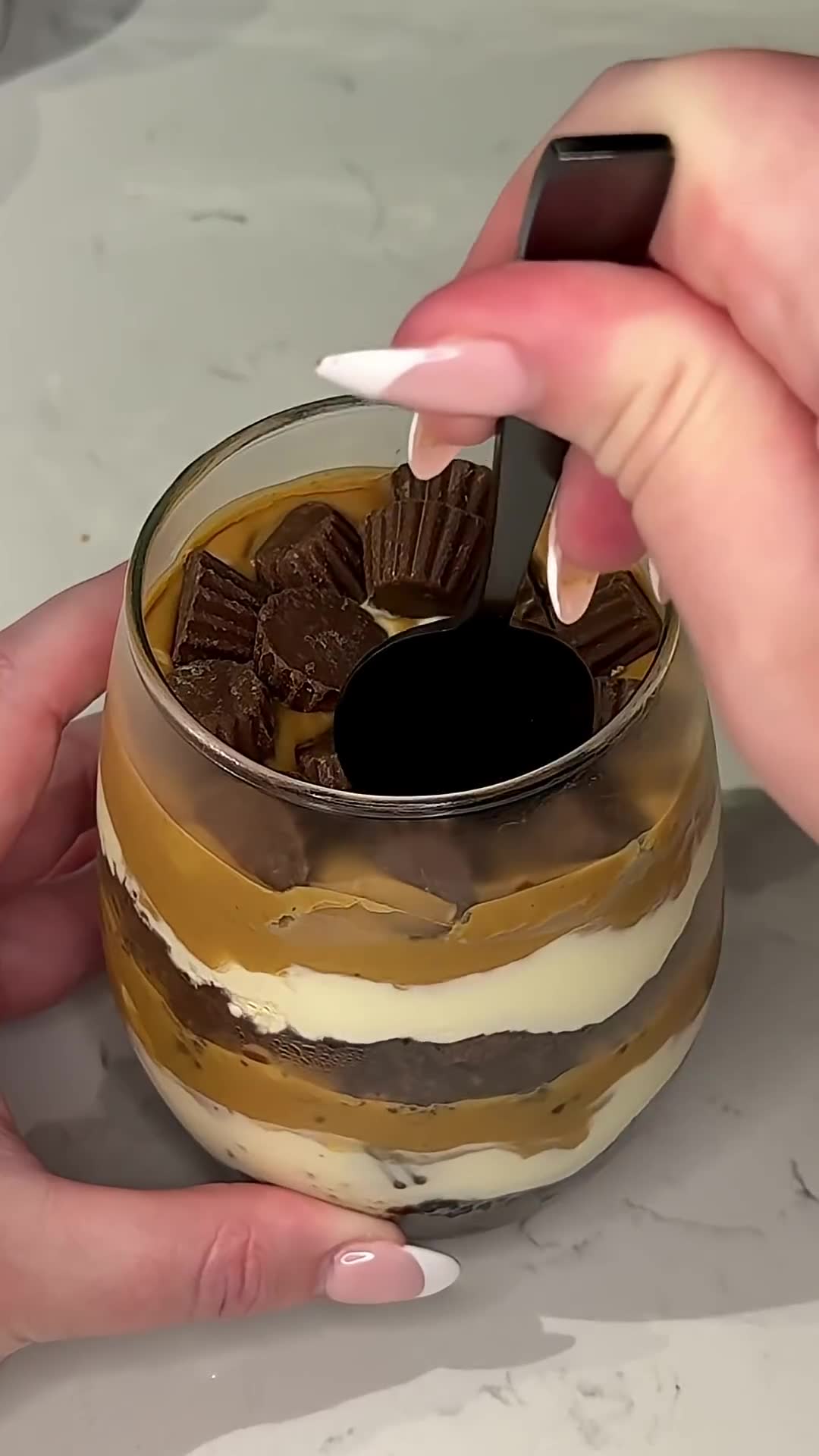 Miniature cheesecake features chocolate foundation and nutty topping