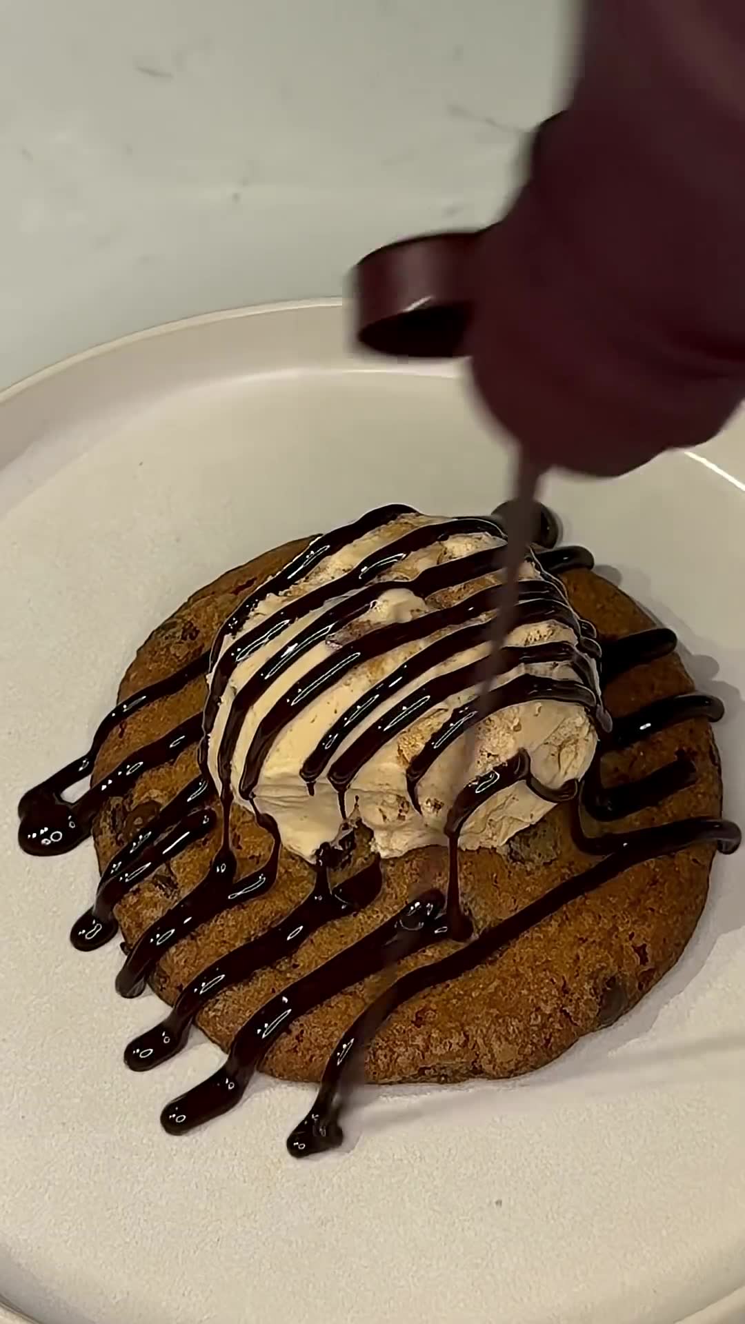 Peanut butter cups hidden inside chocolate chip cookies create surprise