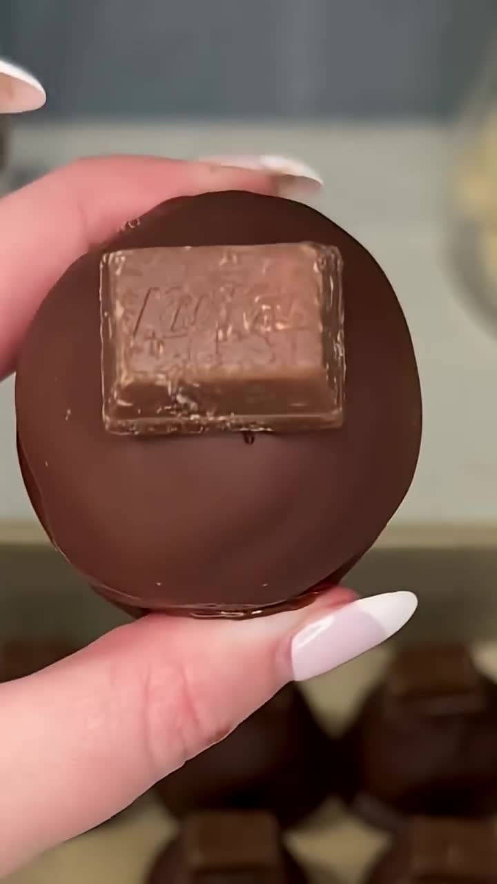 Candy bar pieces embedded in cookie cake pops add crunchy surprise