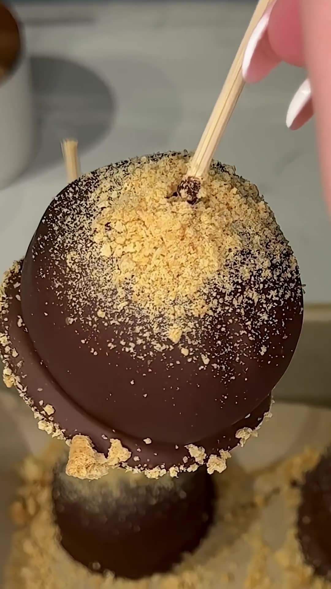 Cake balls combine marshmallow and graham with chocolate coating