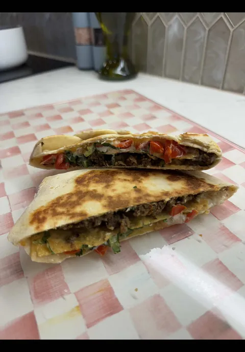 Super fly super fresh crispy golden beef quesadilla with cheese and veggies showcase