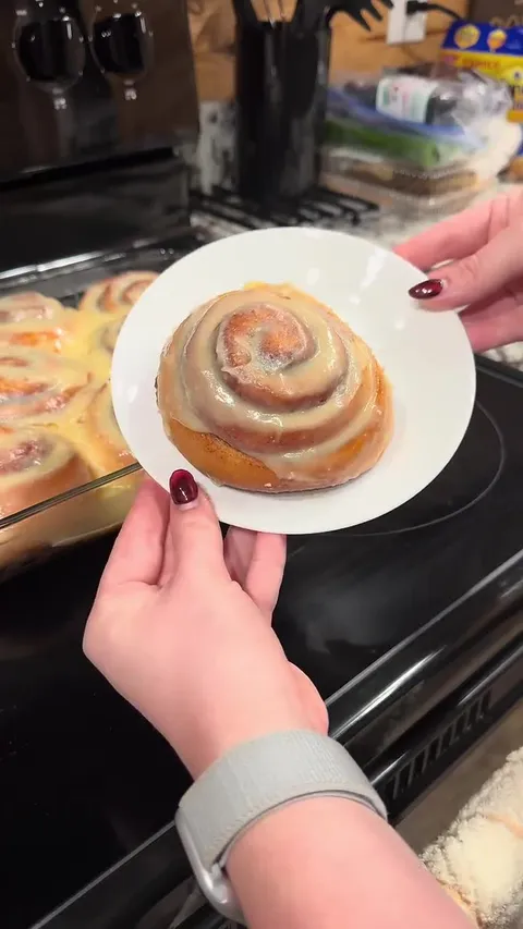 Vacation baking session creating cinnamon rolls for the family