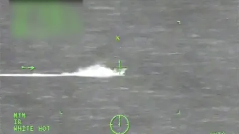 Drug trafficking vessel approaches carrier strike group security zone boundary