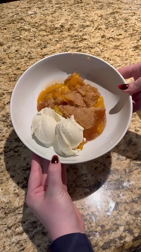 Fresh peach cobbler and hand-churned vanilla ice cream combo