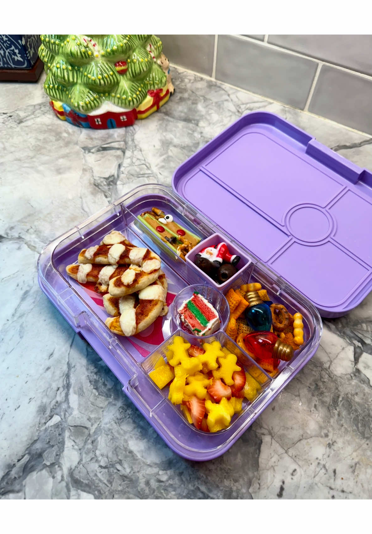 Holiday bento box with shaped pizza and high-protein dairy ingredient