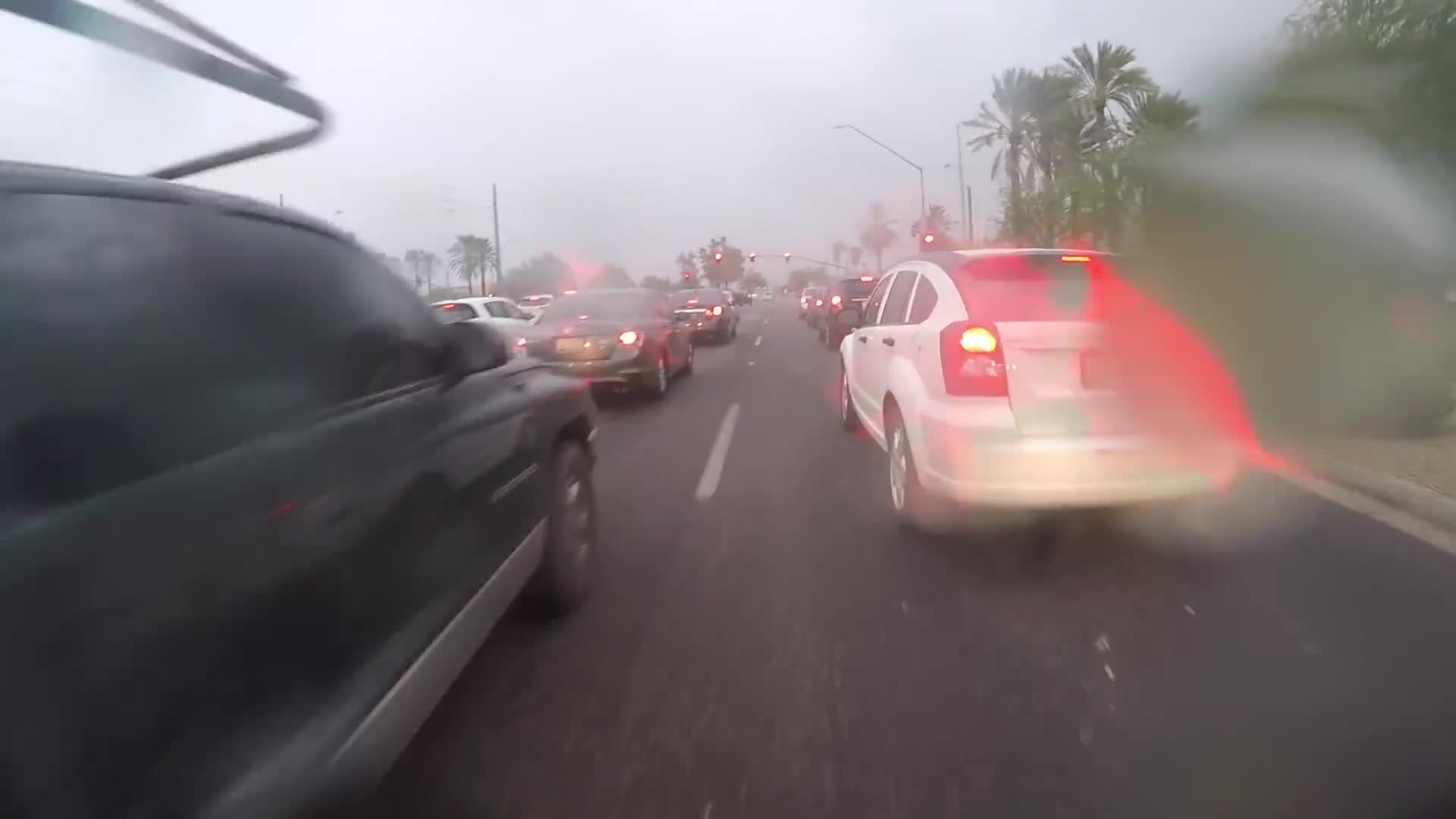 Riding in Arizona monsoon storm filmed from motorcycle perspective on the street