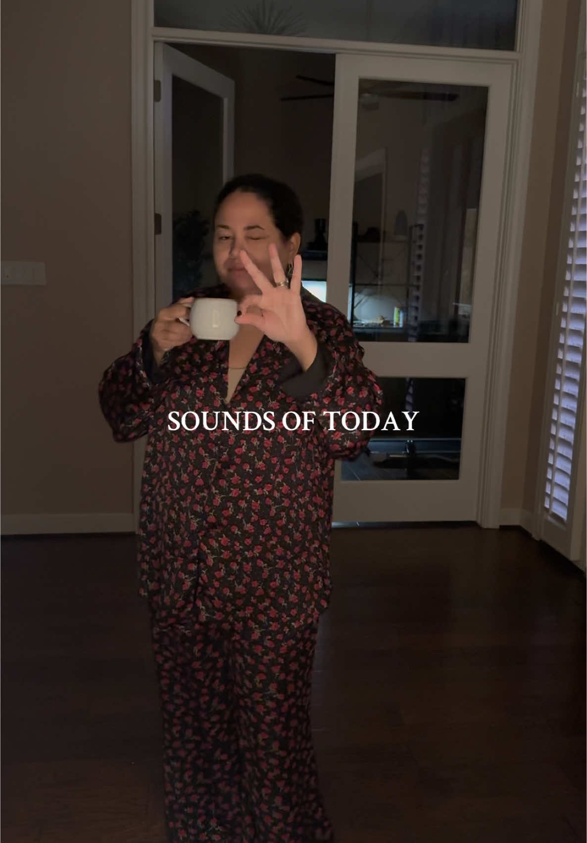 Sounds of today winking woman in floral pajamas making necklaces tired hand crafting