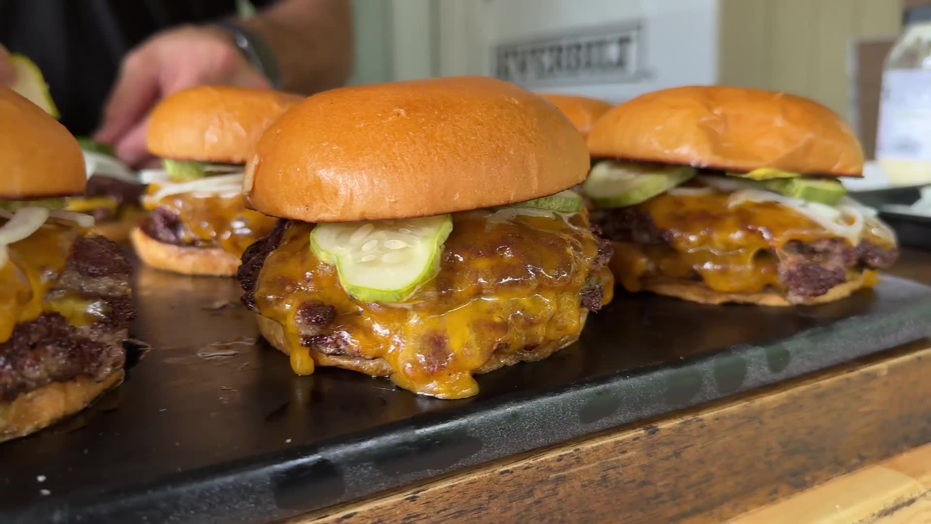 Perfect smash burgers with lacy crispy crust on a hot flat griddle