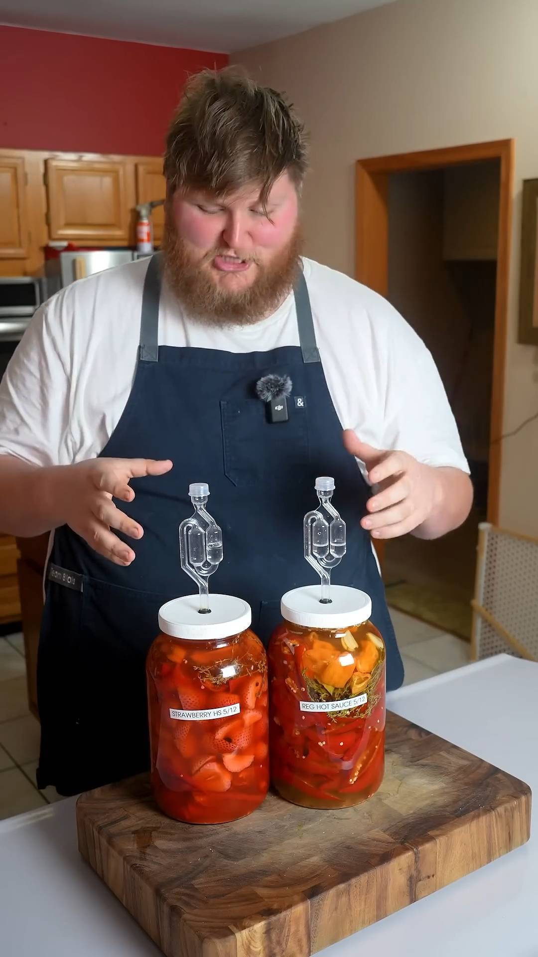 Dangerous homemade hot sauce combining fermented peppers with strawberries