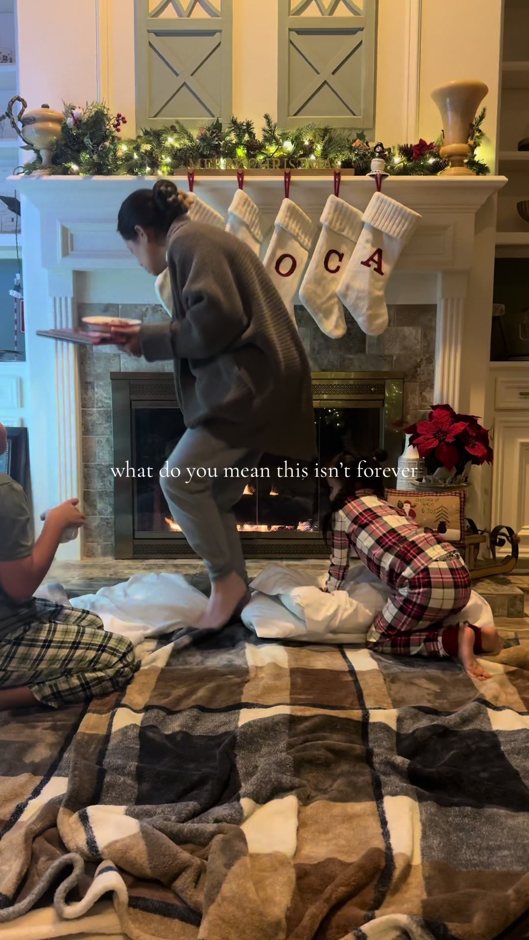 Cozy christmas family night fireplace kids pajamas snacks moments wishing they lasted forever