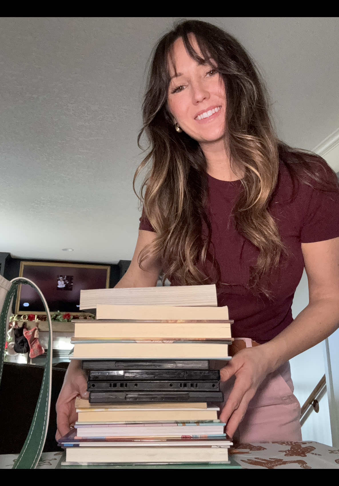 Library haul reveal featuring books, movies, and reading schedule