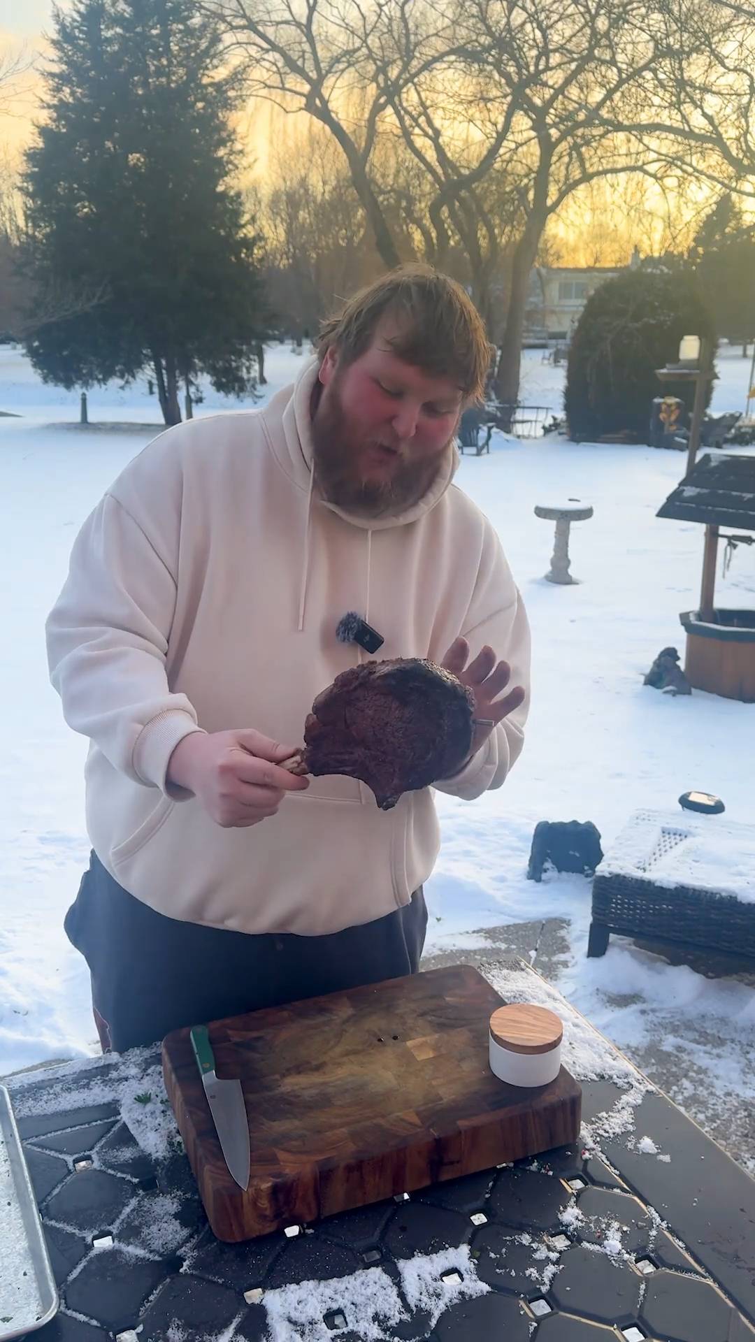Grilling a stunning tomahawk steak outdoors in the middle of winter snow