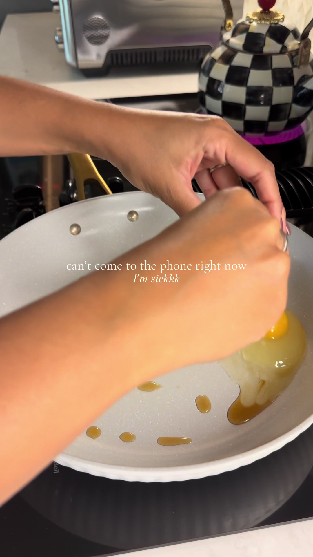 A fried egg in a pan with oil drops while feeling sick easy breakfast cooking