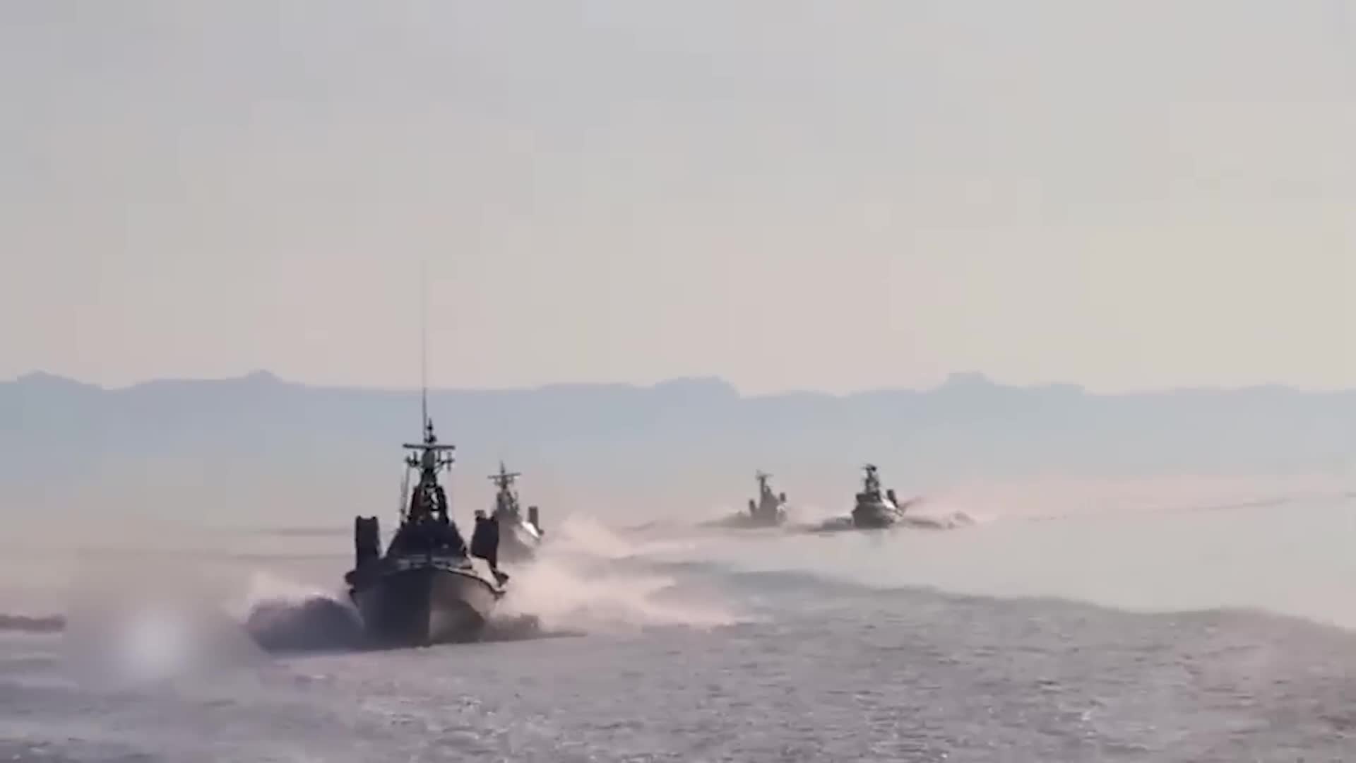 Iranian speedboat swarm attacks destroyer