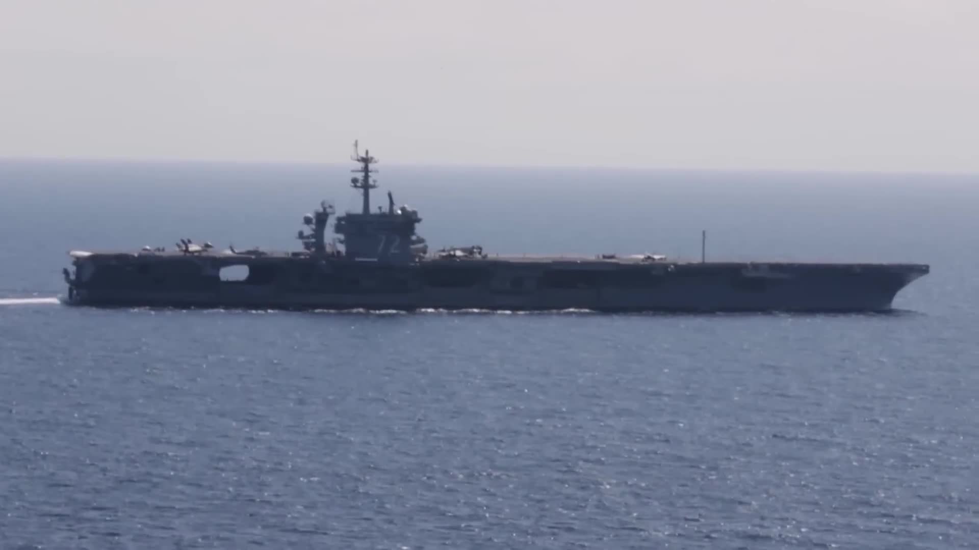 Iranian naval forces confront Abraham Lincoln carrier strike group at sea