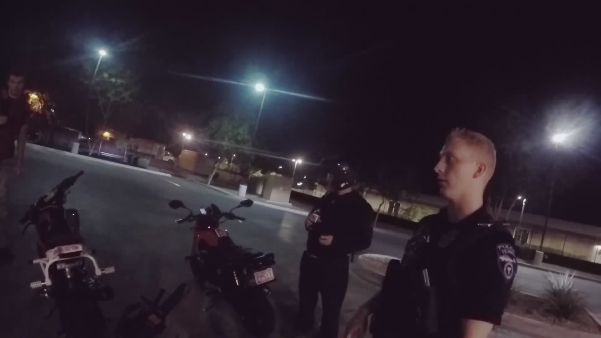 Police officer admires motorcycles during traffic stop
