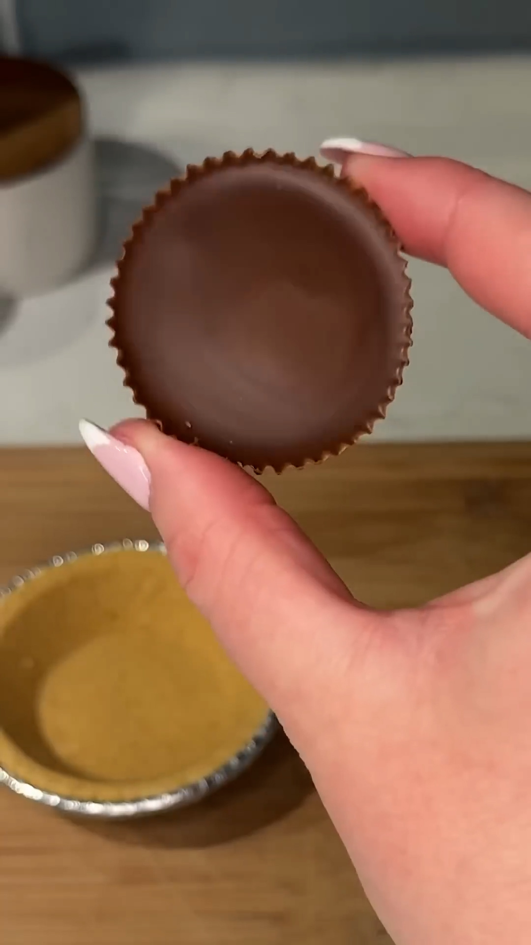 Peanut butter cup candy pieces baked into pan cookie