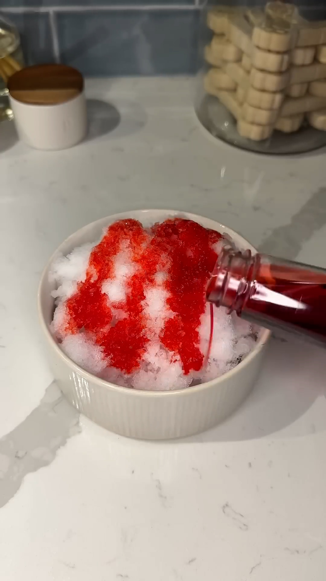 Frozen fruit dessert made by shaving ice and adding berry syrup
