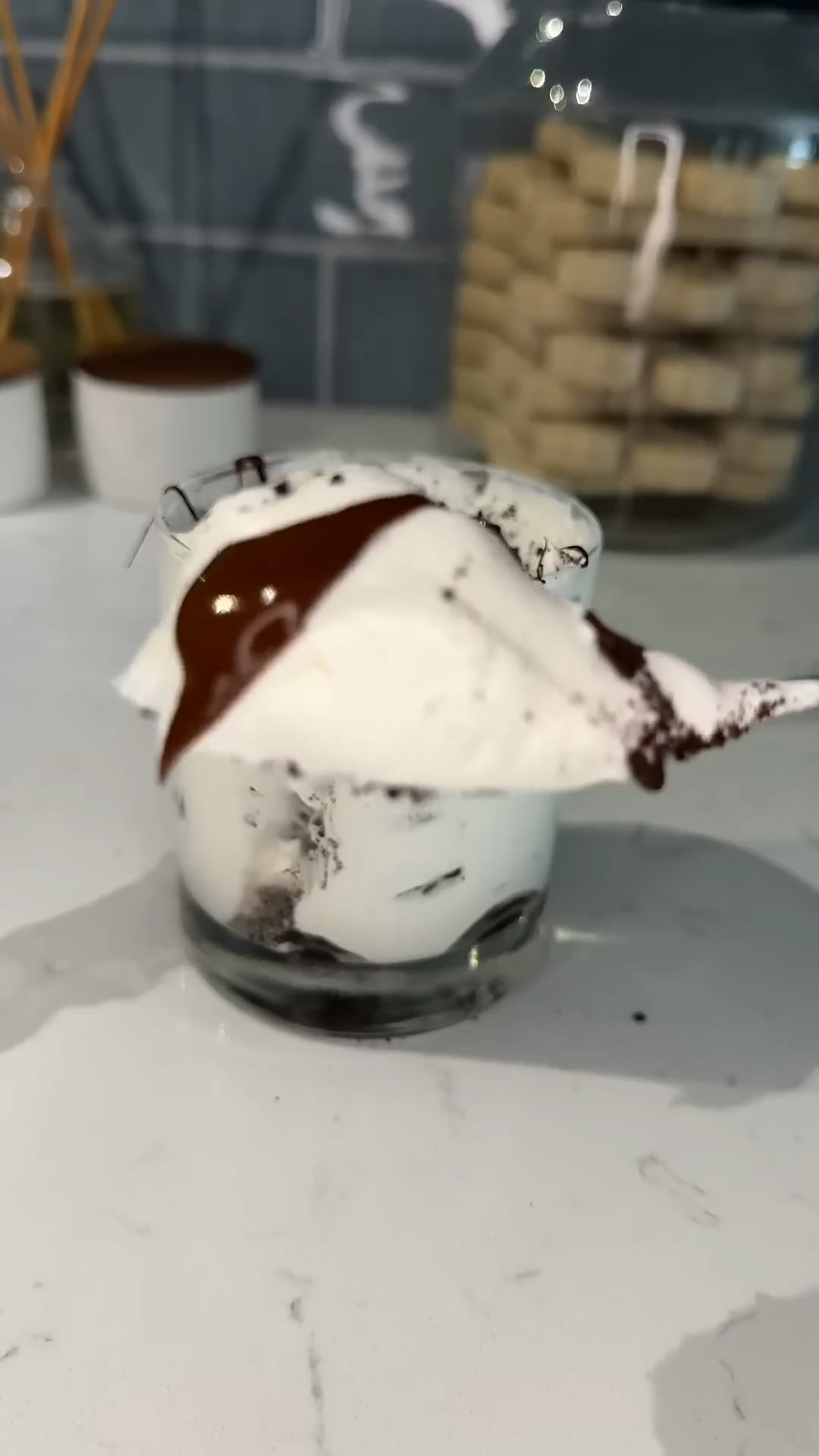 Single-serving layered dessert with cookies and cream