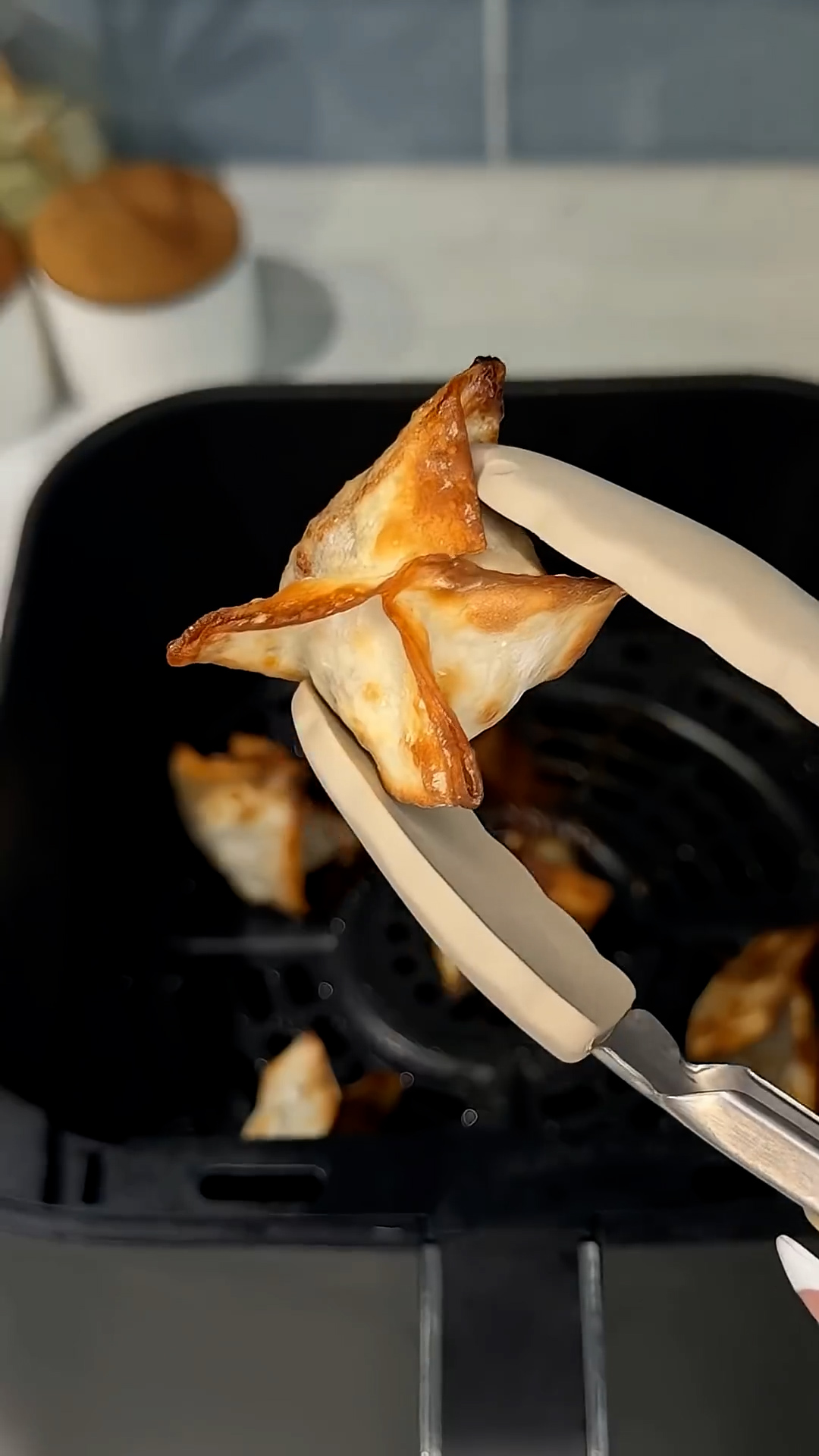 Chocolate pieces wrapped in wonton wrappers and fried until crispy