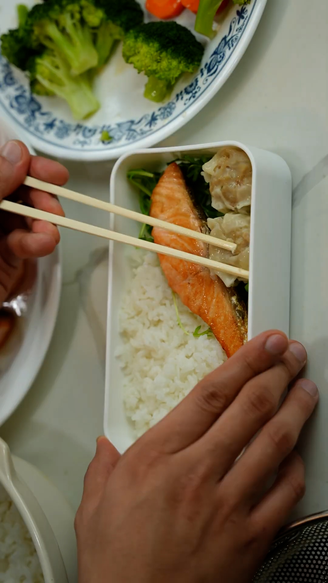Assembling a balanced salmon bento box with all the essentials