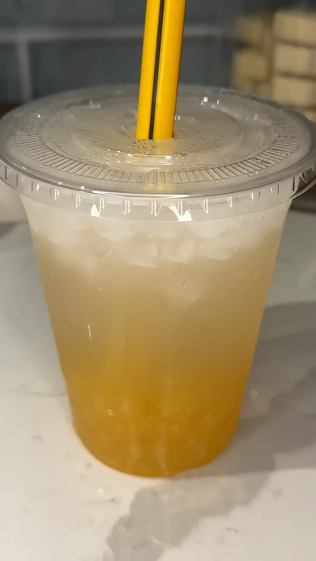 Peach bubble tea features homemade popping boba spheres