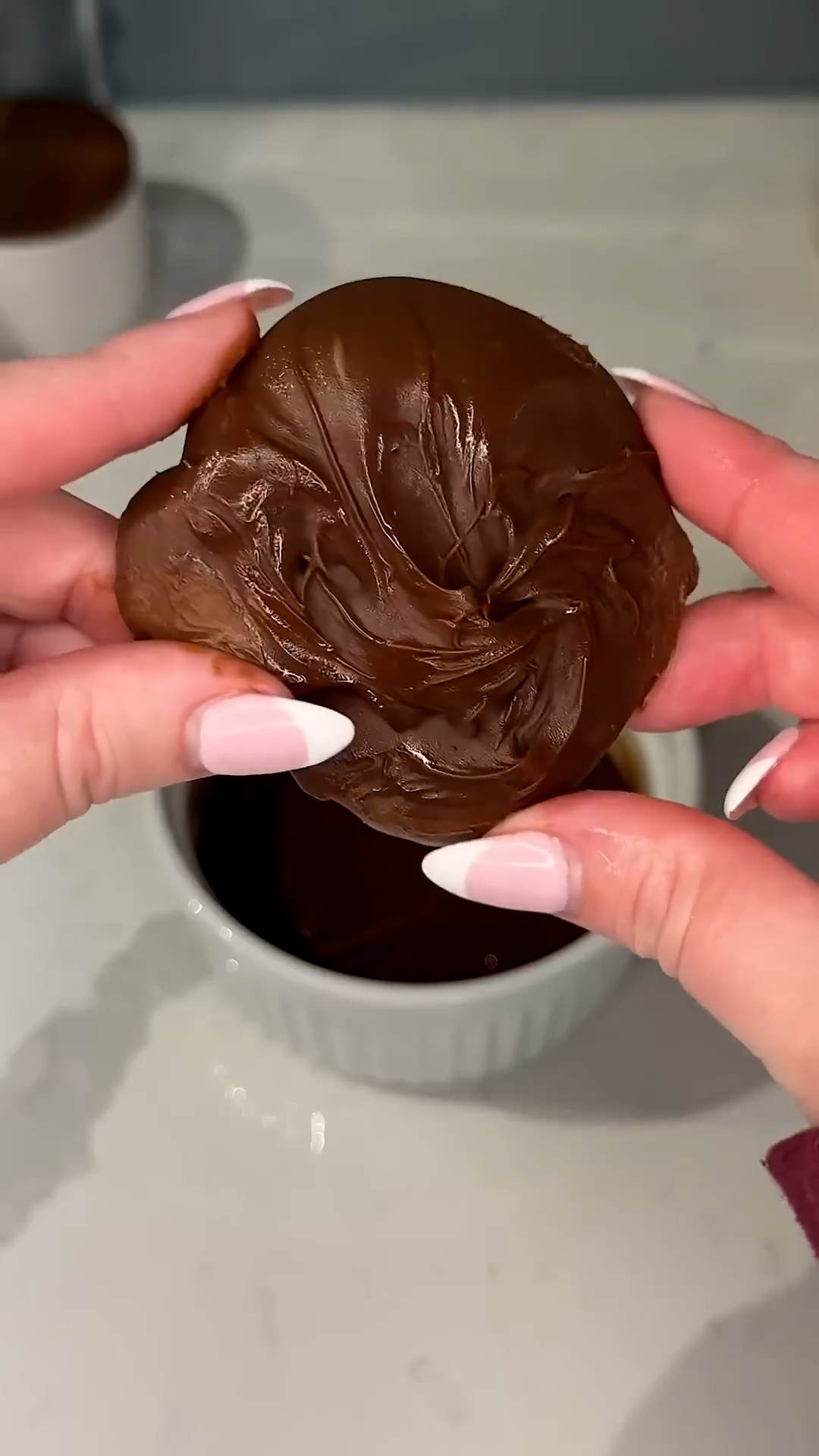 Three items create individual cakes with flowing chocolate