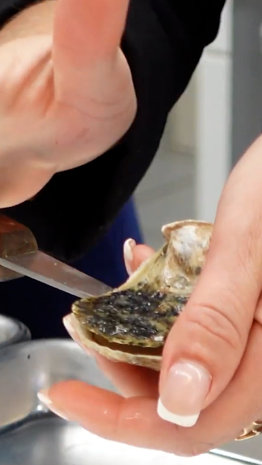 A French chef prepares luxurious champagne poached oysters