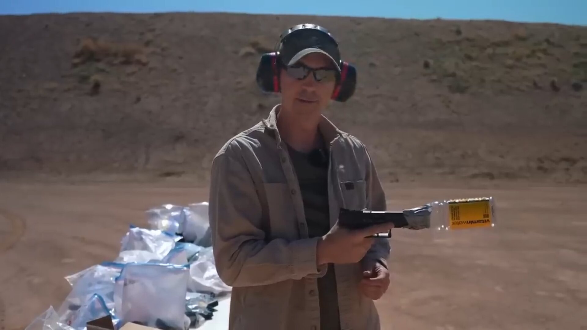 What actually happens when you fire a handgun through a soda bottle